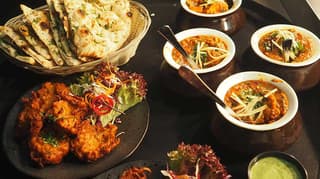 A tray filled with restaurant food.