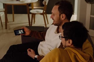 Two people watching a video on a phone.

clickbait titles