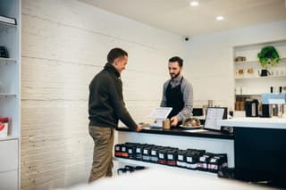 person checking out at a store counter

point of sales marketing