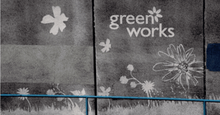 reverse graffiti example with flowers and logo