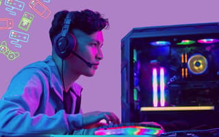 man gaming on pc, gaming icons, colorful keyboard