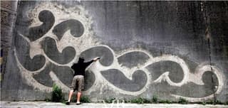 example of reverse graffiti on a wall