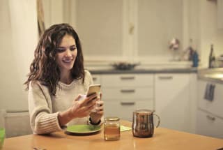 A woman looking at her phone