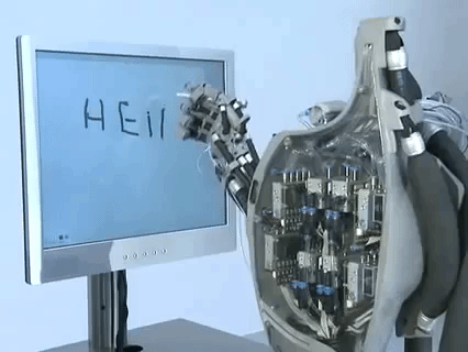 Robot writing "hello" on a computer